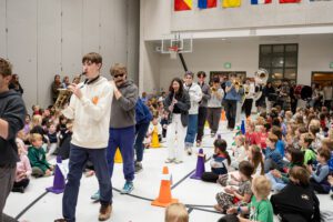 Park City Education Foundation band playing instruments through crowd