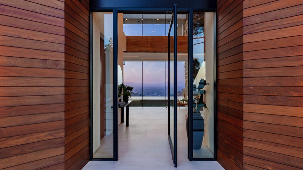Home with new glass door Integrated Door & Window Systems