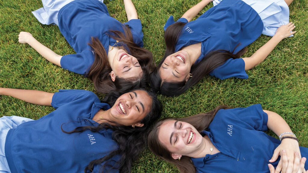 Students on grass Academy of the Holy Angels