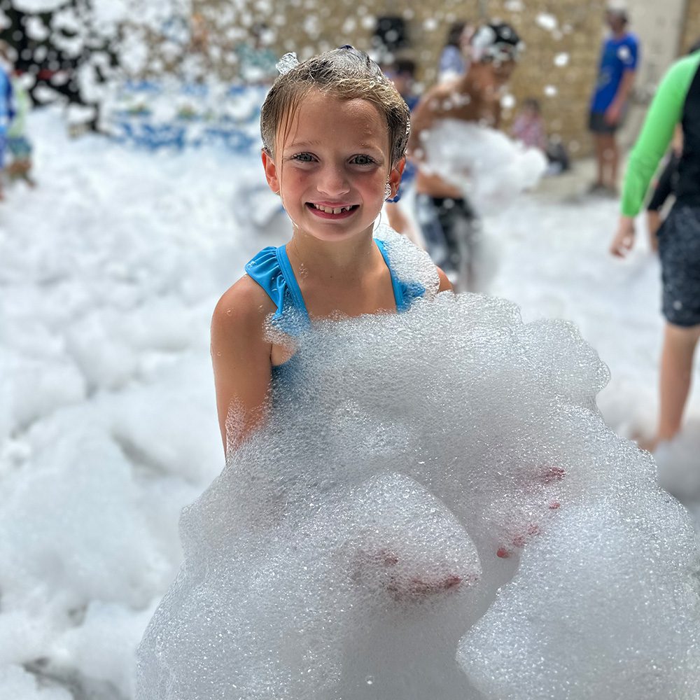 Girl holding bubbles at Big Summer Sendoff The City Of Auburn Parks And Recreation