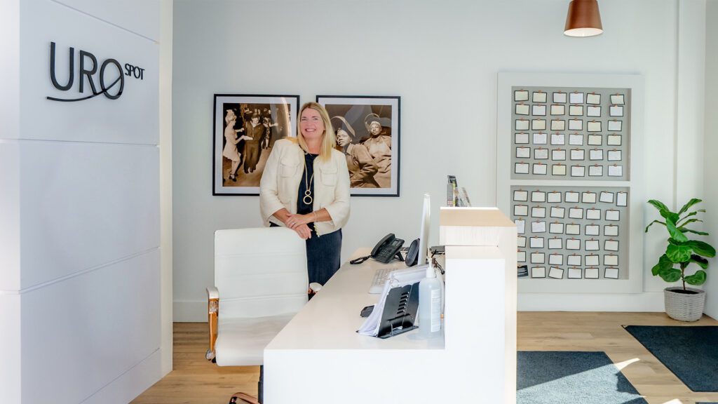 Lori Robinson by desk UROSPOT Ancaster Hamilton