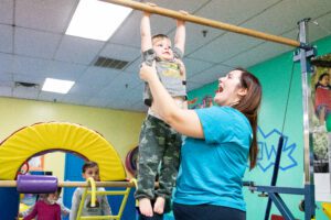 Tumble-Bee Gymnastics playing with children