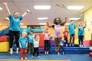 Tumble-Bee Gymnastics playing with children
