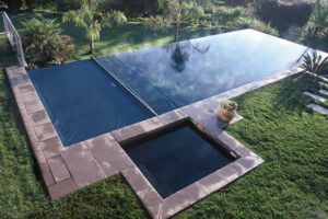 automatic-spa-cover-spill-over-Osterhus-Outdoors-Fiberglass-Pools.jpg