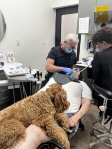 Miller Dentistry scout helping dentist procedure