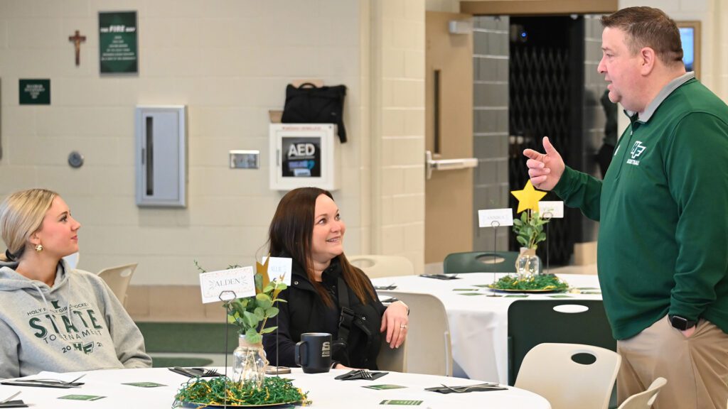 Talking at banquet Holy Family Catholic High School