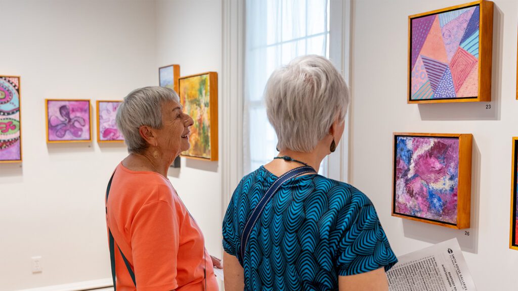 Women looking at art gallery VMRC - Virginia Mennonite Retirement Community
