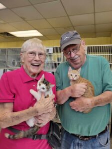 Dawn VanKampen Five Star Lakeshore people holding puppies