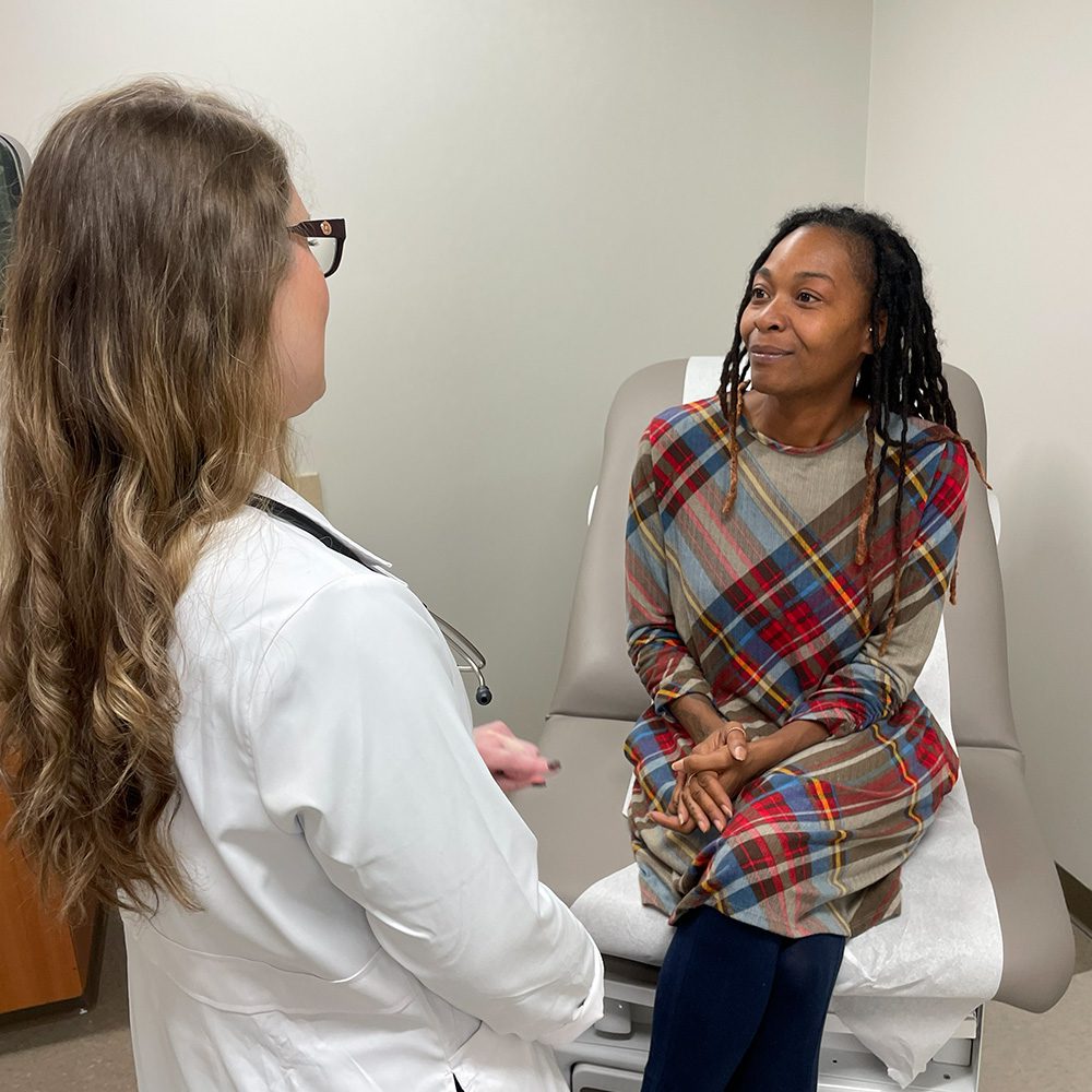 Jennifer Tatalovich, M.D. Williamson Health talking with patient