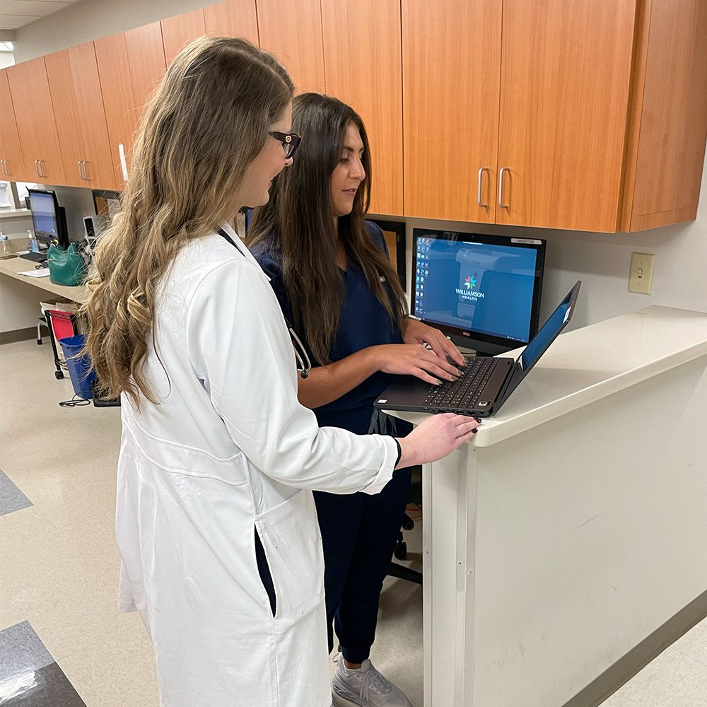 Jennifer Tatalovich, M.D. Williamson Health with nurse in office
