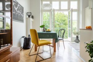 Kirsten Reilly Real Estate LLC Stylish apartment decor idea, eclectic kitchen with balcony, real photo