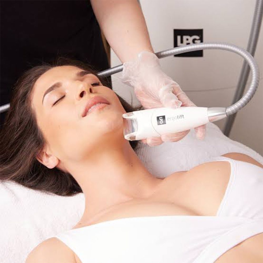 LPG Endermologie device being used on woman's face Revival Wellness Studio