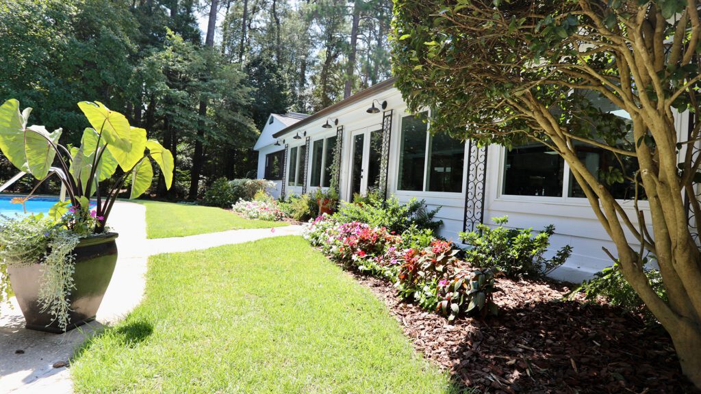 Landscaping outside house with pool Fore Properties
