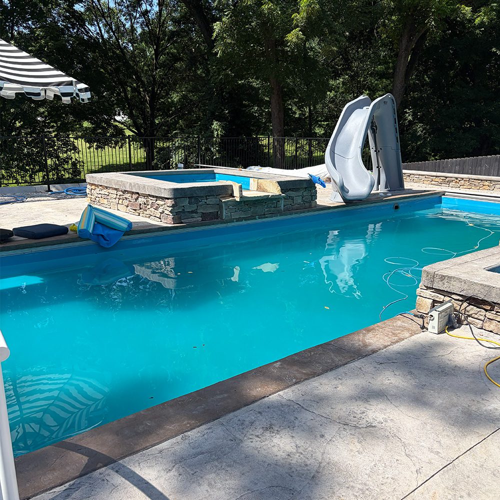 Outdoor pool in yard KD Signature Pools LLC
