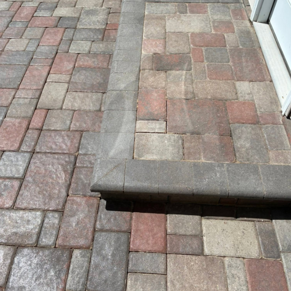 Paver repair by door Patriot Exterior Solutions LLC