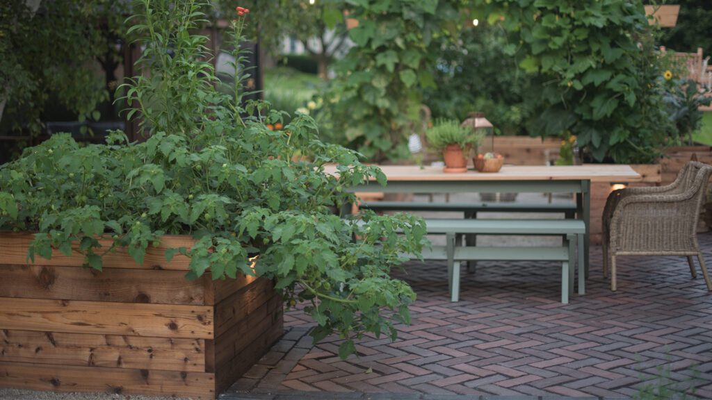 Table and chair by garden Homegrown Gardens