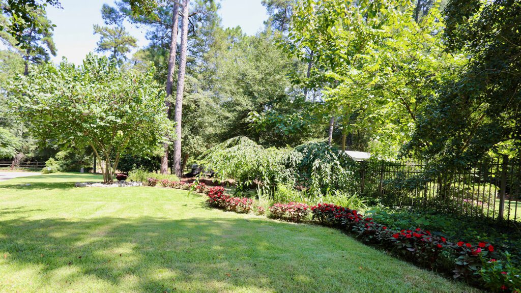 Yard with flowers Fore Properties